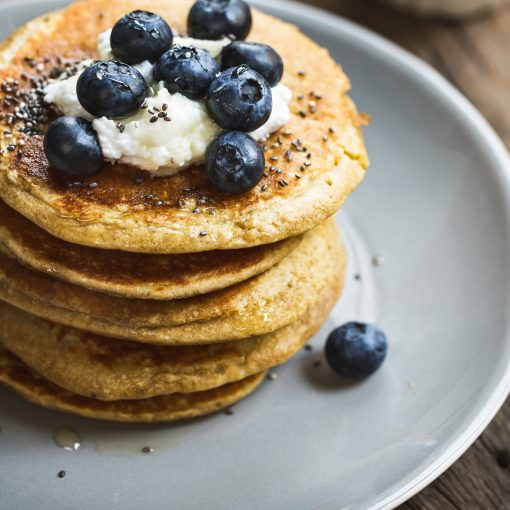 Banana Oat Pancakes with Blueberries, Coconut cream and Chia topping