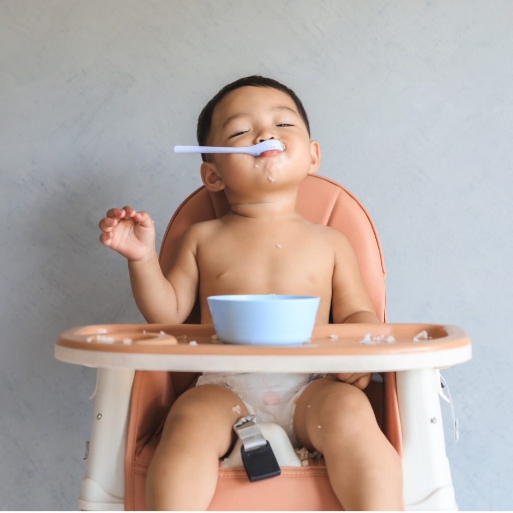 Young child enjoying oatmeal